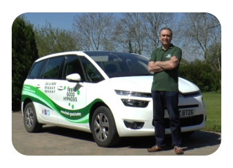 Hypnotist Turan Mirza next to Feel Good Hypnosis car